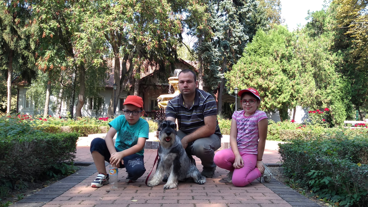 Family photo father, children and schnauzer